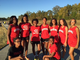 Cross country team poses for a photo.
