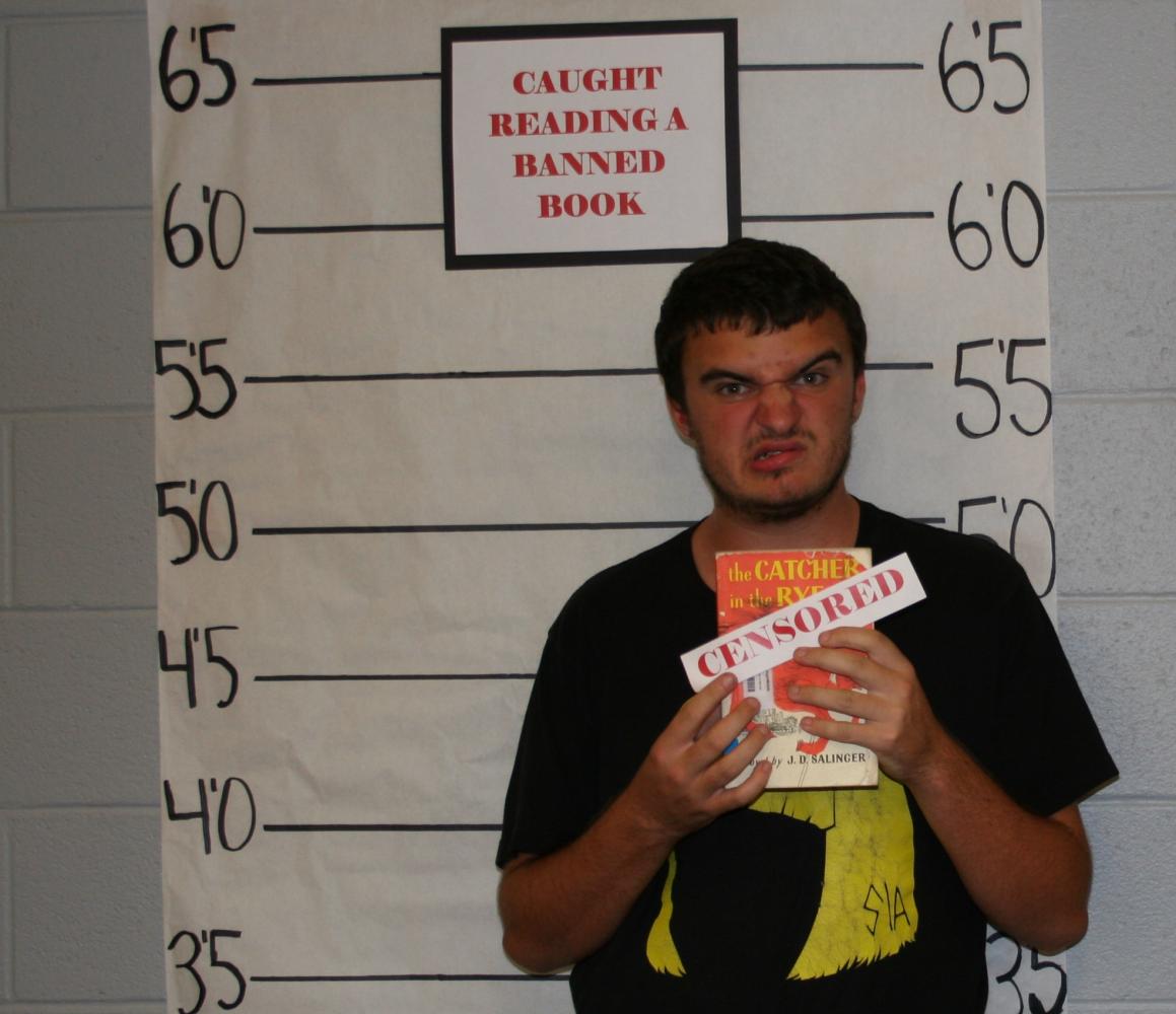 Jake Lankford holds a copy of J.D. Salingers The Catcher in the Rye, one of the most censored books in American literature since its publication in 1951.