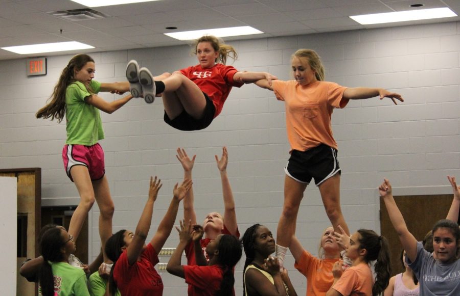 The CHHS Cheer Team, shown practicing in October, earned the title of Regional Champions at the Mid-South Regional cheer competition. The team also earned a bid to the National High School Cheerleading Championship in February.