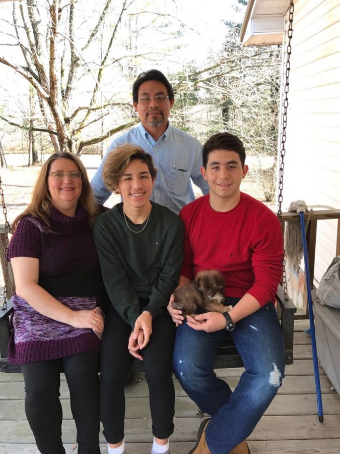 To senior Stephen Shol, seated in center, "Christmas means family and being together and spreading kindness."