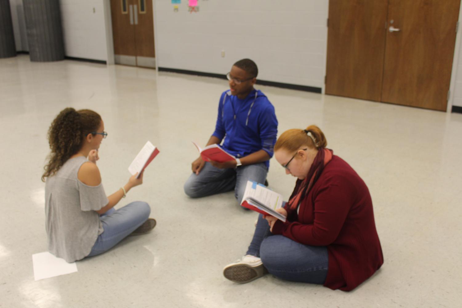 CHHS drama students McKayla Beckmann, from left, Joseph Griffin and Christina White rehearse lines from the play “Suite Surrender.” The play, a farce set in the 1940s, will be performed Dec. 7-9.