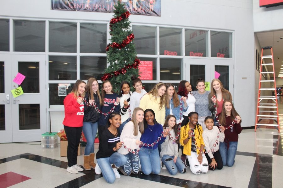 Members of the Center Hill Dance Team pose for a group photo before helping decorate the CHHS Christmas tree.