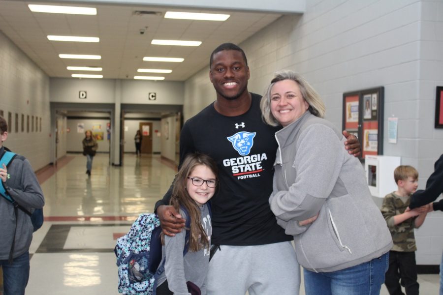 CHHS alum Dan Ellington, center, pictured with Harper Green and Toni Coleman, was a surprise guest at Deck the Hill.