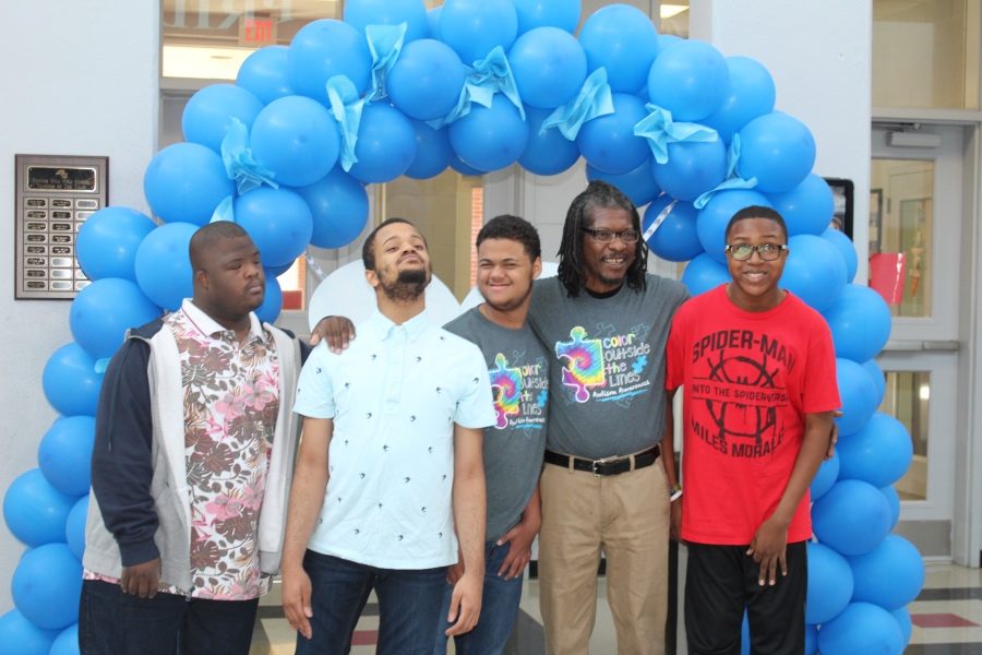 Ron Thompson, second from right, poses with members of the community-based classroom at Center Hill High School during a balloon release for Autism Awareness Month. From left are William Jones III, Michael Green-Owens, Corey Craine, Thompson, and Ernest Gaines Jr.