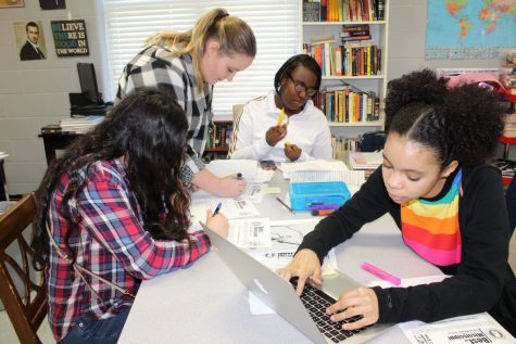 Using guidelines from the Mississippi Scholastic Press Association, Nada Herzallah, from left, Paige Brick, Nadia Sumlar and Kris Randle select entries for inkstained, CHHSs literary magazine. The theme of this years issue is Inside My Head.