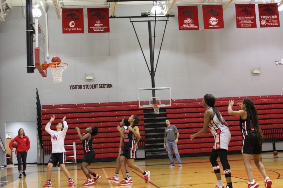 Hope Mealer, Taylor Ware and Kaitlyn Scott practice a rebounding drill Nov. 1.