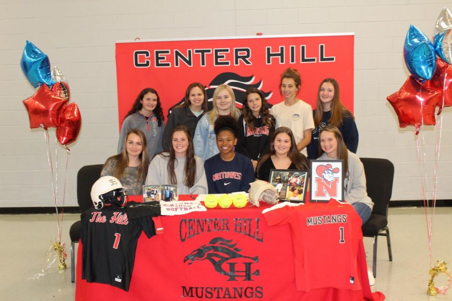 An outfielder for the Lady Mustangs, Laila Armstrong poses with her teammates at her Nov. 11 signing to play softball at Northwest Mississippi Community College.