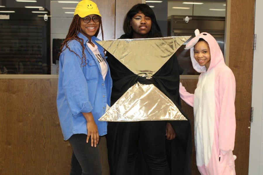 From left, junior Tyreahnna Tillman, sophomore Camron Jackson and junior Kris Randle dressed up for History vs. Future on the second day of Winterfest.