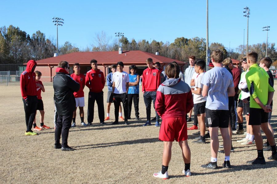 Head boys soccer coach Andrew Yeoman speaks to the team before a practice in November. The Mustangs, with a 16-1 record, won their first ever state championship Feb. 8 against Long Beach.