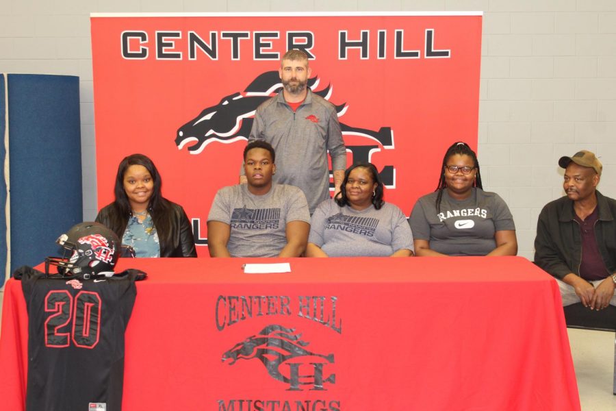 Five Mustangs signed Feb. 5 to play college football. It was the most athletes to sign at once in school history. At a morning ceremony in the PAC, center David DuVall and cornerback Javarrius Shipp signed with Northwest Mississippi Community College, safety Jacquez Hardin signed with Coahoma Community College, and outside linebacker Jared Rayo signed with Millsaps College. At 4:30 that afternoon, left tackle James “Big James” Mitchell, pictured here, also signed with Northwest.