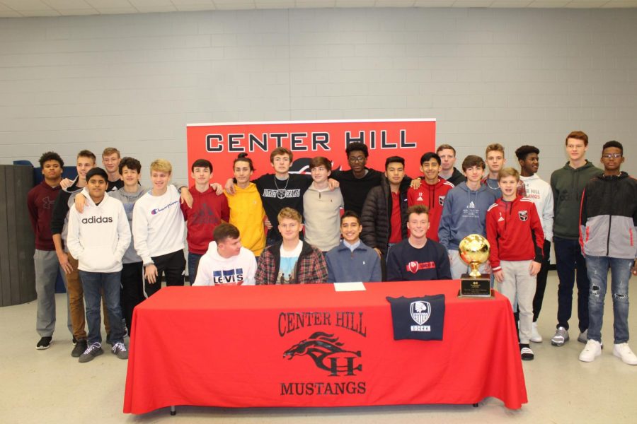 Surrounded by his teammates, Diego Valenzuela signed today to play soccer at Itawamba Community College. Valenzuela scored the winning goal Feb. 8 in Center Hills 2-1 defeat of Long Beach for the Class 5A state championship.