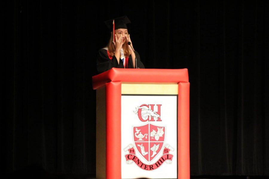 Salutatorian Destiny Pettis wipes away tears during her graduation speech. Pettis’s overall average was 100.6.