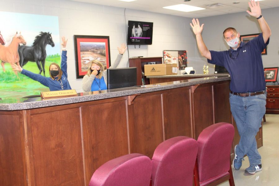 From left, receptionist Mandi Osborne, school nurse Brittany Crum, and Assistant Principal Zack Sims react to the announcement that CHHS is a National Blue Ribbon School. Principal Doug Payne said plans for a celebration are in the works.