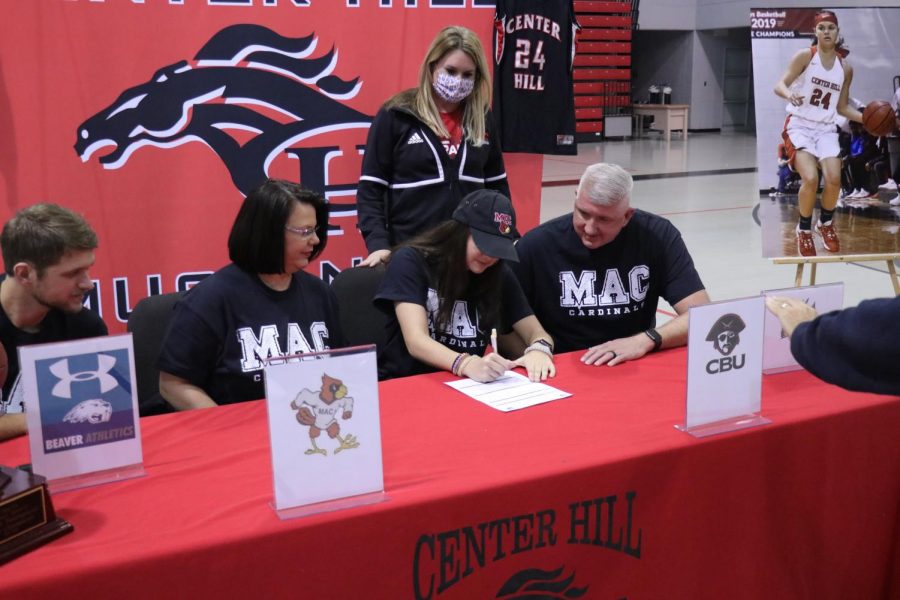 Hope Mealer, pictured with her family and Mineral Area College womens basketball coach Briley Palmer, signed a letter of intent Nov. 24 to play next year for MAC. Mealer, a shooting guard for the Lady Mustangs, said she chose MAC “because it has everything I want.”