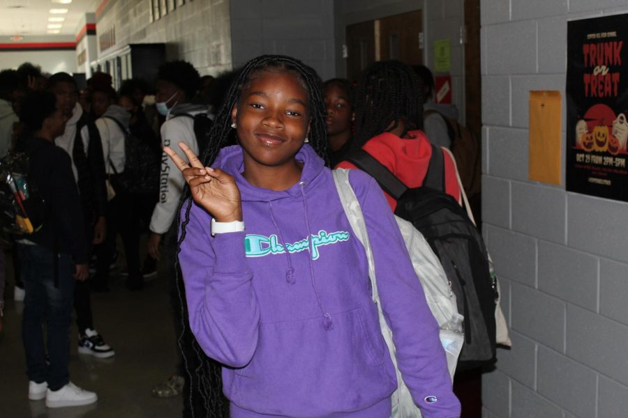 Freshman, Aprille Edmond, dresses in purple for Domestic Violence Awareness.