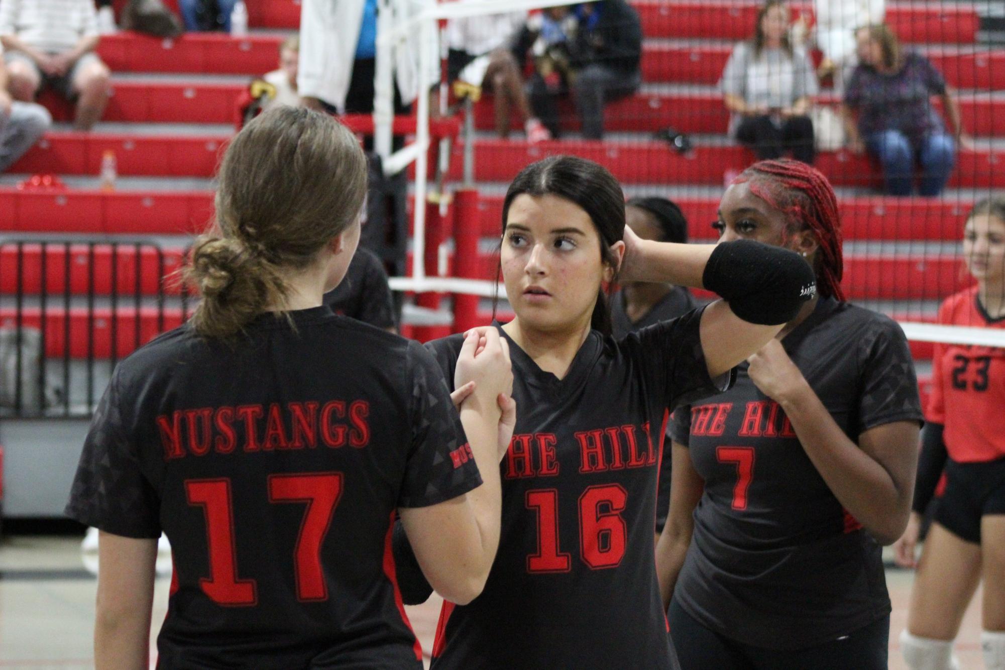 Volleyball celebrates win against South Panola for senior night.