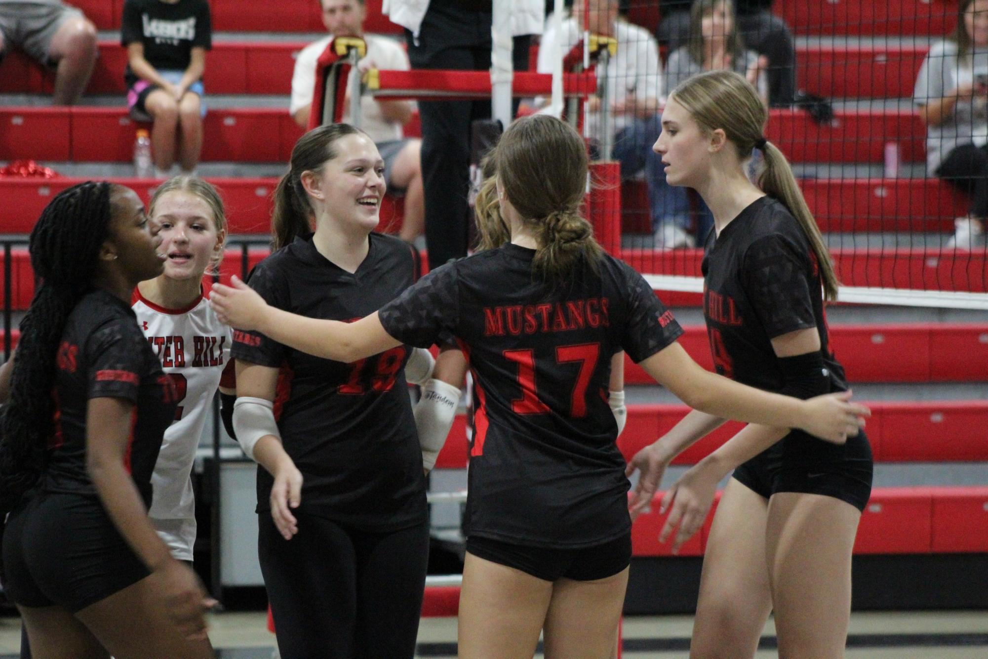 Volleyball celebrates win against South Panola for senior night.