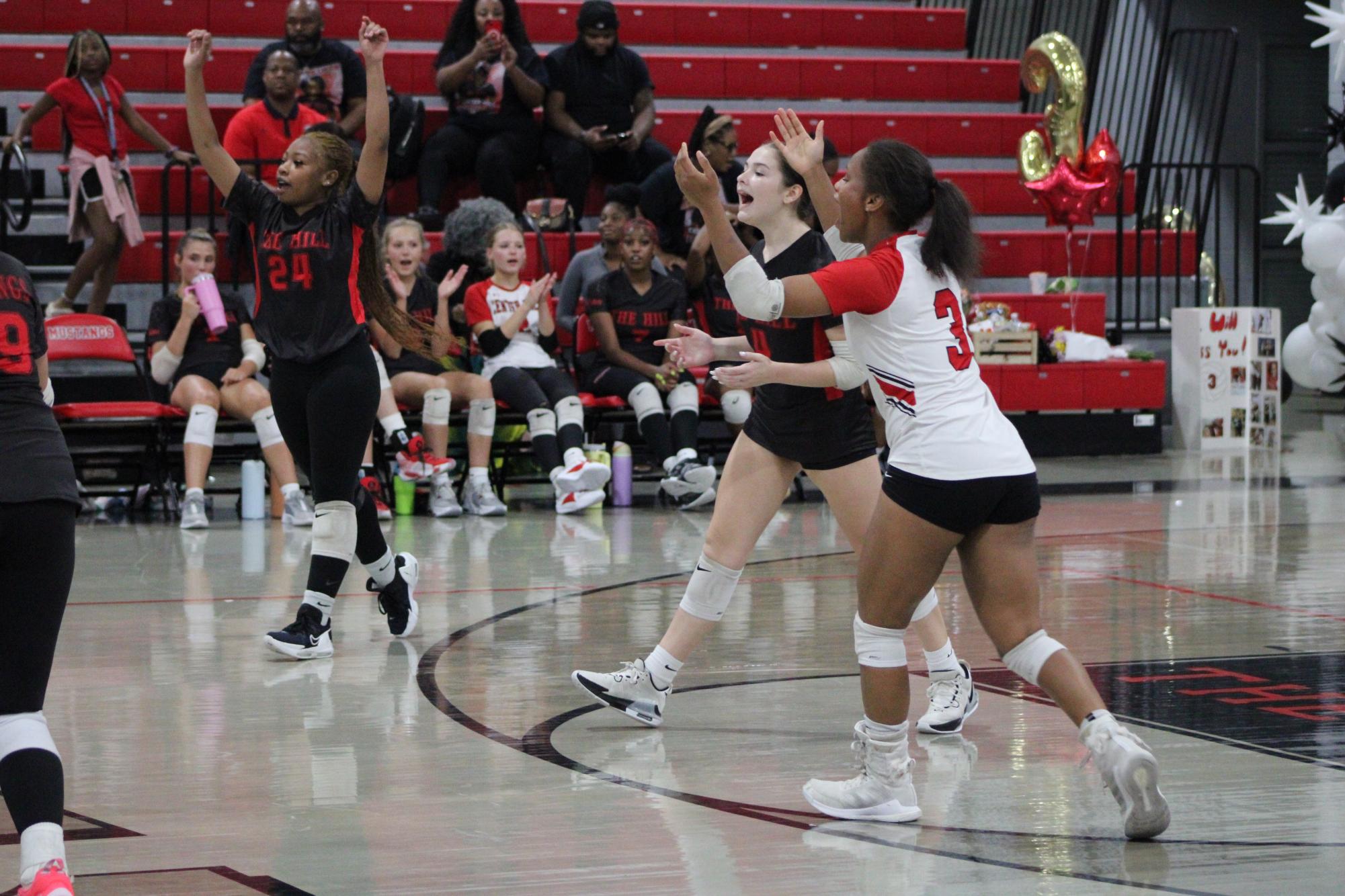 Volleyball celebrates win against South Panola for senior night.